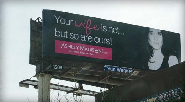 Ashley Madison billboard reading "Your wife is hot but so are ours"