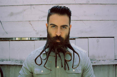 Man with a beard that spells out 'beard'.