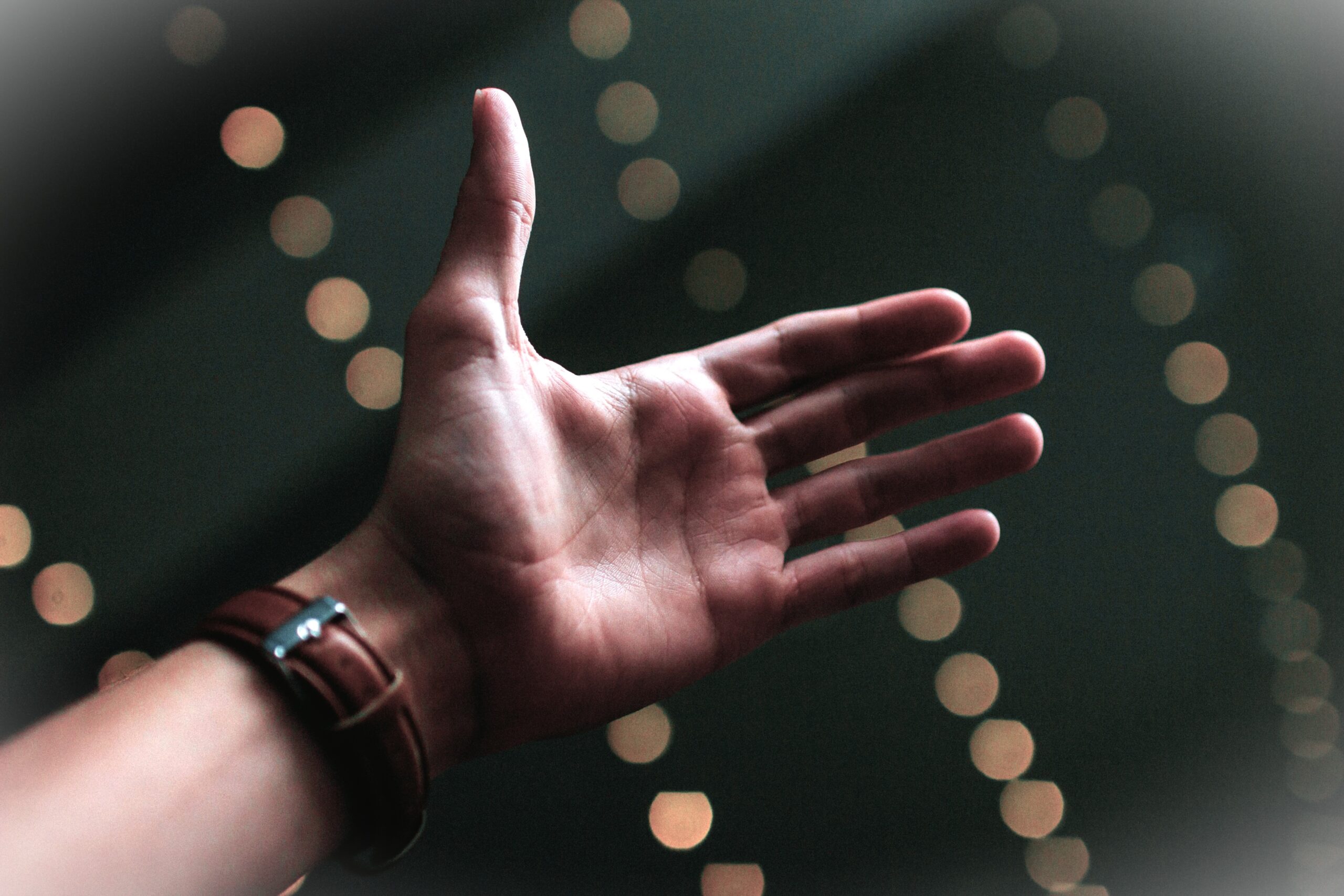 A man's hand showing the palm. Photo by Jordan Whitfield on Unsplash